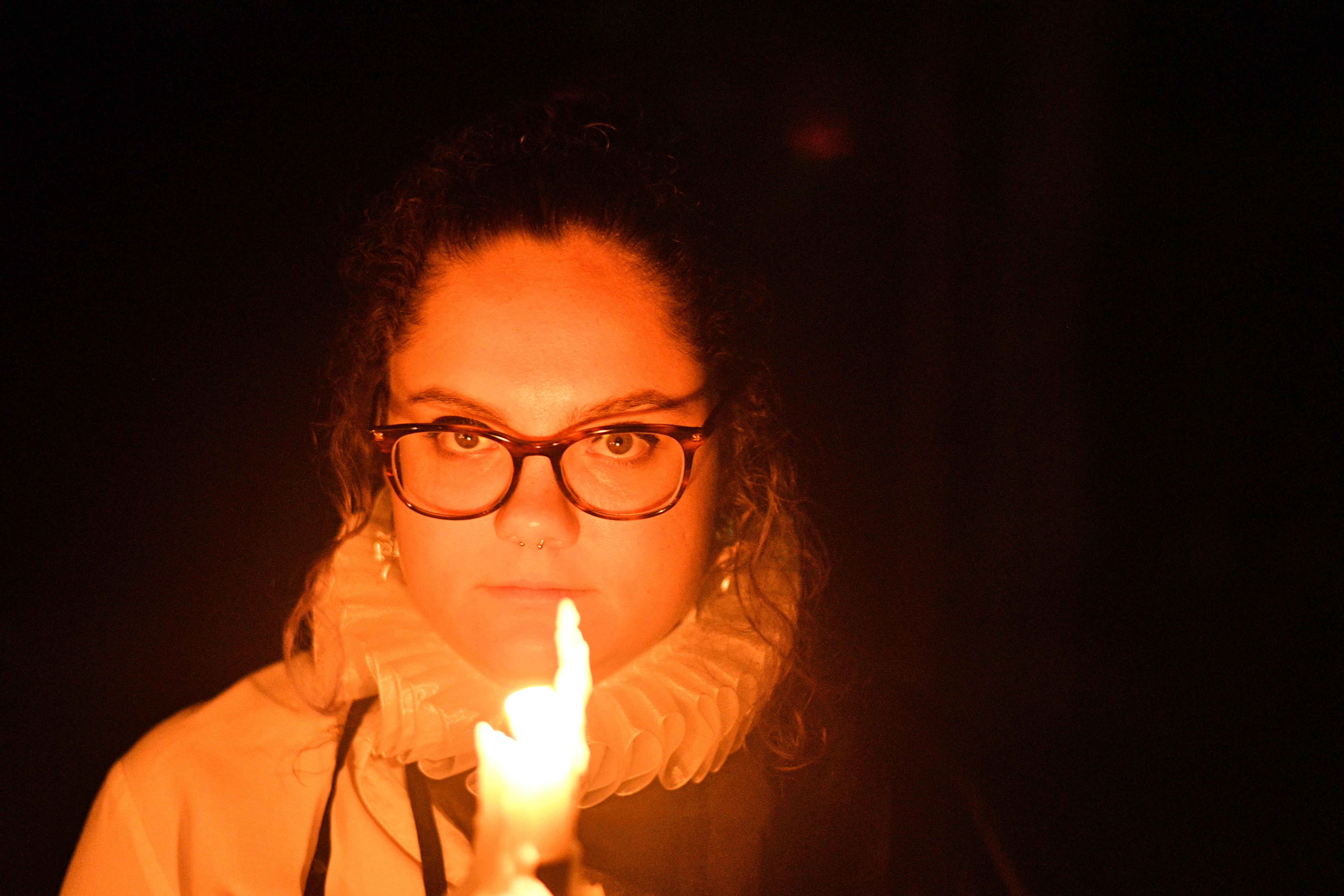 A woman by candlelight