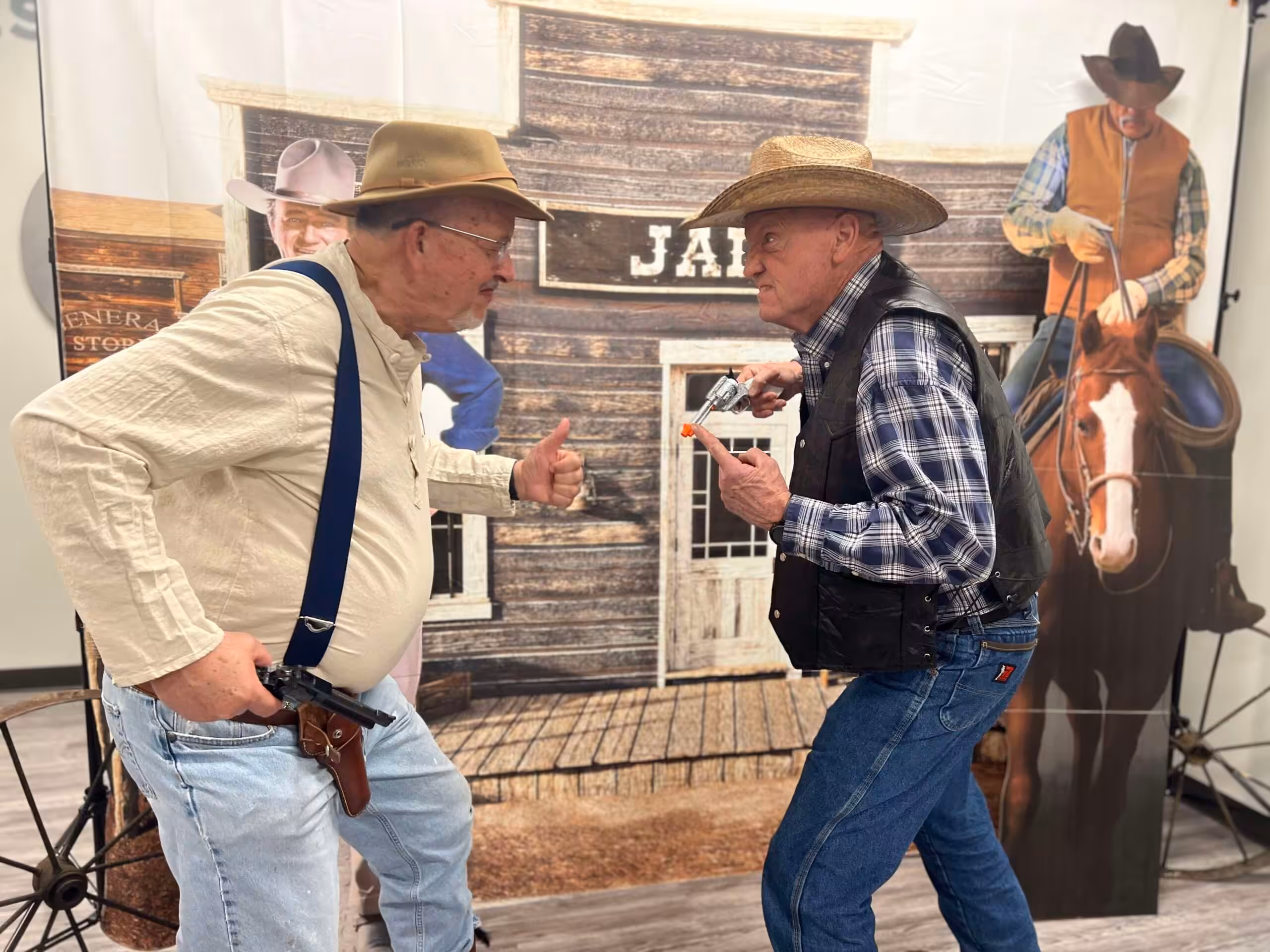 Two people playing at being gunfighters face each other in a Wild West murder mystery game