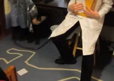 Playing our A Heroic Death murder mystery game.