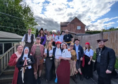 People in pirate costumes playing our Davy Jones Locker murder mystery game.