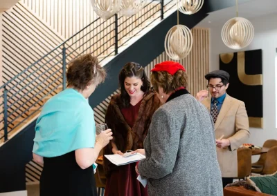 People playing our Dazzled to Death murder mystery party.