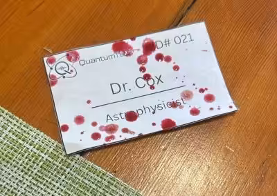 Blood spattered nametag from A Fatal Theory
